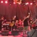 Penampilan grup musik rock Jambi, Enjoy Band, saat manggung di Rock Rise Vol 2 di Senyala Space pada Senin malam (27/2/2023). (Foto RJ.COM)