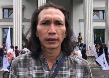 Aksi massa buruh tolak Perppu Ciptaker di DPRD Provinsi Jambi,Selasa (14/3/23). Foto (Goes-Aksara24.id)