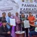 Kabid Humas Polda Jambi, Kombes Pol. Mulia Prianto saat menghadiri Pameran Karikatur di Mall WTC Jambi, Minggu (10/09). (Dok.Deni)